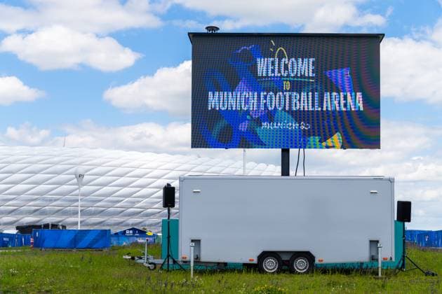 Munich, Bavaria, Germany - May 30, 2025: Welcome in front of the stadium on a screen: Welcome to Munich Football Arena. Impressions of the Munich Football Arena one day before the UEFA Champions League final between Inter Milan and Paris Saint-Germain PSG