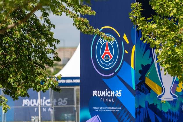 Munich, Bavaria, Germany - May 30, 2025: Paris Saint-Germain logo with UEFA Munich 25 Final lettering on a pillar in front of the entrance. Impressions of the Munich Football Arena one day before the UEFA Champions League final between Inter Milan and Paris Saint-Germain PSG