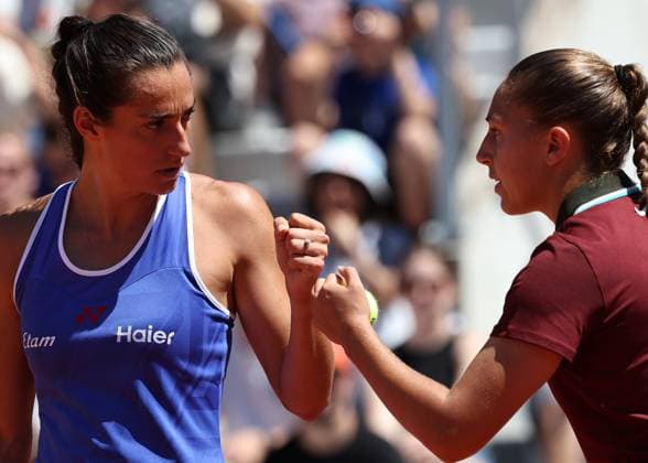 (250530) -- PARIS, May 30, 2025 -- Caroline Garcia (L) Diane Parry react during the women s doubles 2nd round match between Caroline Garcia Diane Parry of France and Ninomiya Makoto of Japan Tang Qianhui of China at the French Open tennis tournament at Roland Garros, Paris, France, May 30, 2025. ) (SP)FRANCE-PARIS-TENNIS-FRENCH OPEN-WOMEN S DOUBLES LixJing 
