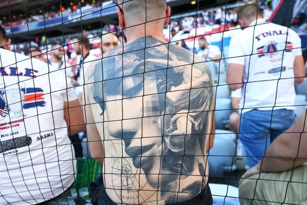 A tattoo on the back of a fan Paris Saint-Germain v Inter Milan, UEFA Champions League Final, Football, Allianz Arena, Munich, Germany - 31 May 2025 EDITORIAL USE ONLY No use with unauthorised audio, video, data, fixture lists, club league logos or live services. Online in-match use limited to 120 images, no video emulation. No use in betting, games or single club league player publications.  Copyright: xMichaelxZemanek Shutterstockx 15330931a