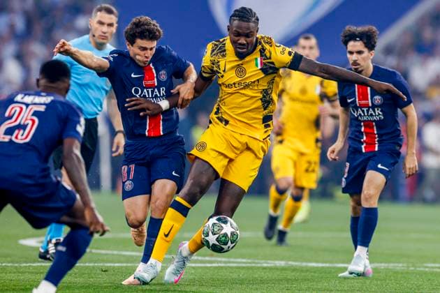 Marcus Thuram of FC Internazionale dribbles with the ball under pressure from Joao Neves of Paris Saint-Germain Paris Saint-Germain v FC Internazionale Milano, UEFA Champions League Final 2025, Paris Saint-Germain and FC Internazionale Milano, Munich Football Arena, May 31, 2025, Munich, Germany.