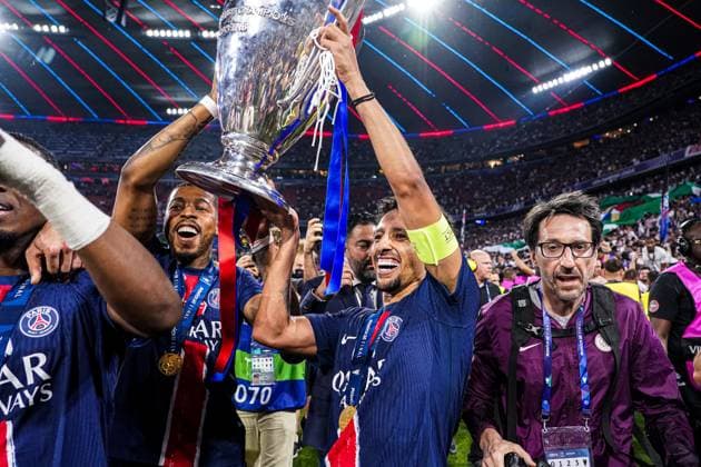 2025-05-31 Paris Saint-Germain v FC Internazionale Milano - UEFA Champions League Final 2025 MUNICH, GERMANY - MAY 31: Presnel Kimpembe of Paris Saint-Germain, Marquinhos of Paris Saint-Germain celebrate with the trophy after winning the UEFA Champions League during the UEFA Champions League Final 2025 match between Paris Saint-Germain and FC Internazionale Milano at Munich Football Arena on May 31, 2025 in Munich, Germany. Munich Munich Football Arena Germany Content not available for redistribution in The Netherlands directly or indirectly through any third parties. Copyright: xJorisxVerwijstx