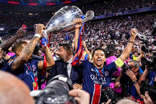 2025-05-31 Paris Saint-Germain v FC Internazionale Milano - UEFA Champions League Final 2025 MUNICH, GERMANY - MAY 31: Presnel Kimpembe of Paris Saint-Germain, Marquinhos of Paris Saint-Germain celebrate with the trophy after winning the UEFA Champions League during the UEFA Champions League Final 2025 match between Paris Saint-Germain and FC Internazionale Milano at Munich Football Arena on May 31, 2025 in Munich, Germany. Munich Munich Football Arena Germany Content not available for redistribution in The Netherlands directly or indirectly through any third parties. Copyright: xJorisxVerwijstx
