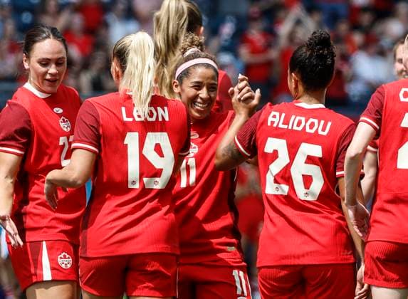 May 31, 2025, Winnipeg, Mb, CANADA: Canada s Desiree Scott (11) embraces Adriana Leon (19) after she scored against Haiti during first half soccer action in Winnipeg, Saturday, May 31, 2025. Haiti Canada Womens Soccer  - ZUMAc35_ 20250531_zaf_c35_080 Copyright: xJohnxWoodsx