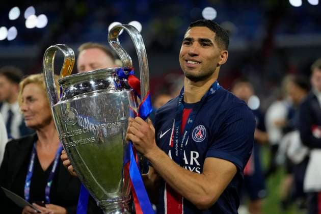 Paris Saint-Germain v FC Internazionale Milano - UEFA Champions League Final 2025 MUNICH, GERMANY - MAY 31: Achraf Hakimi right-back of PSG and Morocco celebrates with the trophy after winning the UEFA Champions League Final 2025 between Paris Saint-Germain and FC Internazionale Milano at Allianz Arena on May 31, 2025 in Munich, Germany. Munich Germany  Copyright: xJosexBretonx originalFilename:bretonhernandez-parissai250531_npNBM.jpg