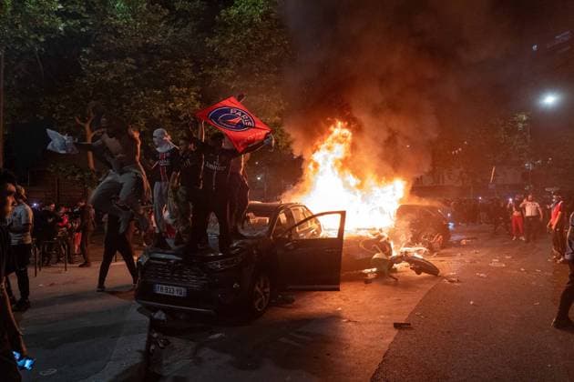 May 31, 2025, Paris, France, FRA: Outside the Parc des Princes, a sea of joy and fireworks: Paris Saint-Germain fans erupt in celebration after their teamâ€⠢s stunning 5-0 triumph over Inter Milan in Munich. With this historic victory, PSG becomes only the second French football clubâ€after Olympique de Marseille in 1993â€to lift the UEFA Champions League trophy. A night of chants, flags, and tears of happiness marked a long-awaited moment for supporters across the capital. However, the festivities were marred by clashes between some groups of fans and the police, with several cars set on fire and tensions flaring in the surrounding streets. Paris FRA - ZUMAl224 0821126056st Copyright: xStefanoxLorussox