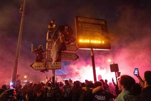 May 31, 2025, Paris, France, FRA: Outside the Parc des Princes, a sea of joy and fireworks: Paris Saint-Germain fans erupt in celebration after their teamâ€⠢s stunning 5-0 triumph over Inter Milan in Munich. With this historic victory, PSG becomes only the second French football clubâ€after Olympique de Marseille in 1993â€to lift the UEFA Champions League trophy. A night of chants, flags, and tears of happiness marked a long-awaited moment for supporters across the capital. However, the festivities were marred by clashes between some groups of fans and the police, with several cars set on fire and tensions flaring in the surrounding streets. Paris FRA - ZUMAl224 0821126396st Copyright: xStefanoxLorussox