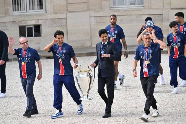 PSG celebrates UCL victory in Elysee Palace PARIS, FRANCE - JUNE 01: Marquinhos (3rd L), head coach Luis Enrique (2nd R) and the President,Nasser Al-Khelaifi (C) of Paris Saint Germain, carry the UEFA Champions League trophy at Elysee Palace in Paris, France on June 01, 2025. Mustafa Yalcin Anadolu Paris World. Editorial use only. Please get in touch for any other usage.  Copyright: x2025xAnadoluxMustafaxYalcinx
