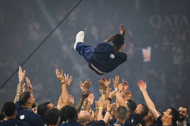 PSG celebrates Champions League trophy at Parc des Princes - FA Paris Saint-Germain’s players throw Paris Saint-Germain’s forward Ousmane Dembele in the air as they celebrate the UEFA Champions League trophy at the Parc des Princes Stadium in Paris on June 1, 2025, the day after PSG won the UEFA Champions League final football match over Inter Milan in Munich, on May 31, 2025. Photo by Firas Abdullah ABACAPRESS.COM Paris Ile-de-France France  Copyright: xAbdullahxFiras ABACAx