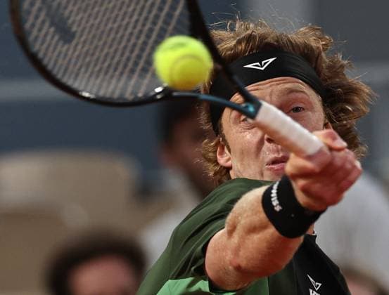 (250603) -- PARIS, June 3, 2025 -- Andrey Rublev of Russia returns a shot during the men s singles 4th round match against Jannik Sinner of Italy at the French Open tennis tournament at Roland Garros, Paris, France, June 2, 2025. ) (SP)FRANCE-PARIS-TENNIS-FRENCH OPEN-MEN S SINGLES LixJing 