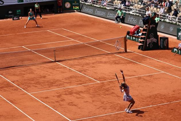 (250603) -- PARIS, June 3, 2025 -- Zheng Qinwen (Front) serves during the women s singles quarterfinal between Zheng Qinwen of China and Aryna Sabalenka of Belarus at the French Open tennis tournament at Roland Garros, Paris, France, June 3, 2025. ) (SP)FRANCE-PARIS-TENNIS-FRENCH OPEN-WOMEN S SINGLES-QUARTERFINAL LixJing 