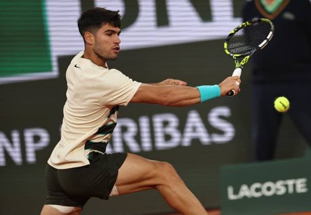 (250604) -- PARIS, June 4, 2025 -- Carlos Alcaraz returns a shot during the men s singles quarter final match between Tommy Paul of the United States and Carlos Alcaraz of Spain at the French Open tennis tournament at Roland Garros, Paris, France, June 3, 2025. ) (SP)FRANCE-PARIS-TENNIS-FRENCH OPEN-MEN S SINGLES LixJing 