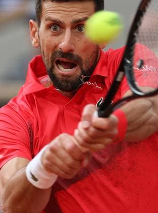 Serb Novak Djokovic plays against top-seeded Jannik Sinner of Italy during their semi-final match at the French Tennis Open in Roland Garros in Paris, France, on Friday, June 6, 2025. Sinner won 6-4, 7-5, 7-6 and advanced to the final.  PAR20250607237 MAYAxVIDON-WHITE