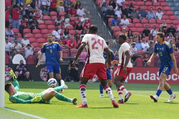 June 7, 2025, Toronto, On, CAN: Canada s Jonathan David slots past Ukraine s goalkeeper Anatolii Trubin for his country s opening goal during first half action in the Canadian Shield Tournament, in Toronto, Saturday, June 7, 2025. Jonathan David; Anatolii Trubin  - ZUMAc35_ 20250607_zaf_c35_076 Copyright: xChrisxYoungx