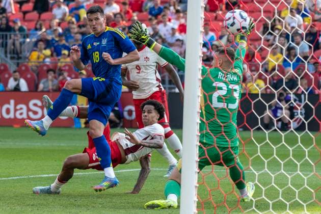 June 7, 2025, Toronto, Ontario, Canada: Tajon Buchanan 17 C) of Canada scores a goal against Dmytro Riznyk 23 (R) and Oleksandr Tymchyk 18 (L) during the Canadian Shield Tournament match at BMO Field on June 7, 2025 in Toronto, Ontario, Canada. The game ended 4-2 for Canada Toronto Canada - ZUMAm154 20250607_zap_m154_012 Copyright: xAngelxMarchinix