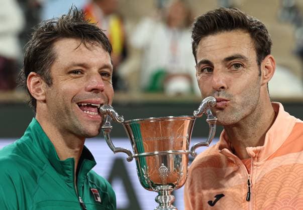 (250608) -- PARIS, June 8, 2025 -- Winners Marcel Granollers (R) Horacio Zeballos pose with the trophy during the awarding ceremony after the men s doubles final match between Marcel Granollers of Spain Horacio Zeballos of Argentina and Joe Salisbury Neal Skupski of Britain at the French Open tennis tournament at Roland Garros, Paris, France, June 7, 2025. ) (SP)FRANCE-PARIS-TENNIS-FRENCH OPEN-MEN S DOUBLES-FINAL LixJing 