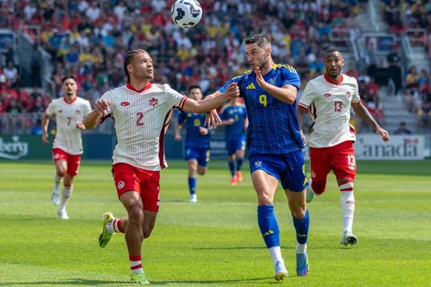 June 7, 2025, Toronto, Ontario, Canada: Zorhan Bassong 2 (L)and Roman Yaremchuk 9 (R) seen in action during the Canadian Shield Tournament match between Ukraine and Canada at BMO Field. Final scores; Canada 4-2 Ukraine. Toronto Canada - ZUMAs197 20250607_aaa_s197_628 Copyright: xAngelxMarchinix