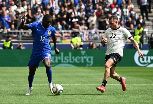 08.06.2025, xsltx, Fussball UEFA Nations League Platz 3, Deutschland - Frankreich v.l. Randal Kolo Muani (Frankreich), David Raum (Deutsche Fussball Nationalmannschaft DFB) (DFL DFB REGULATIONS PROHIBIT ANY USE OF PHOTOGRAPHS as IMAGE SEQUENCES and or QUASI-VIDEO) Stuttgart