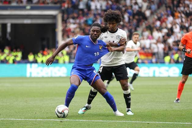 Manu Kone (France) und Karim Adeyemi (Deutschland) battle for the ball during the UEFA Nations League 2025 third place match between Germany and France at Stuttgart Arena on June 8, 2025 in Stuttgart, Germany. (Photo by Oliver Kaelke DeFodi Images)