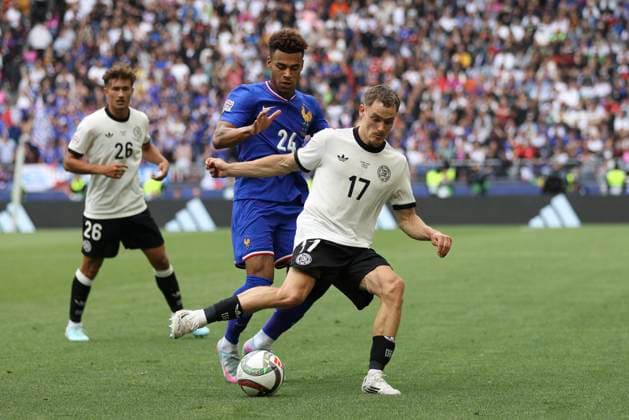 Desire Doue (France) und Florian Wirtz (Deutschland) battle for the ball during the UEFA Nations League 2025 third place match between Germany and France at Stuttgart Arena on June 8, 2025 in Stuttgart, Germany. (Photo by Oliver Kaelke DeFodi Images)