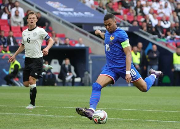(250609) -- STUTTGART, June 9, 2025 -- Kylian Mbappe (R) of France shoots during the UEFA Nations League A third-place match between Germany and France in Stuttgart, Germany, June 8, 2025. (Photo by Xinhua) (SP)GERMANY-STUTTGART-FOOTBALL-UEFA NATIONS LEAGUE-GERMANY VS FRANCE PhilippexRuiz 