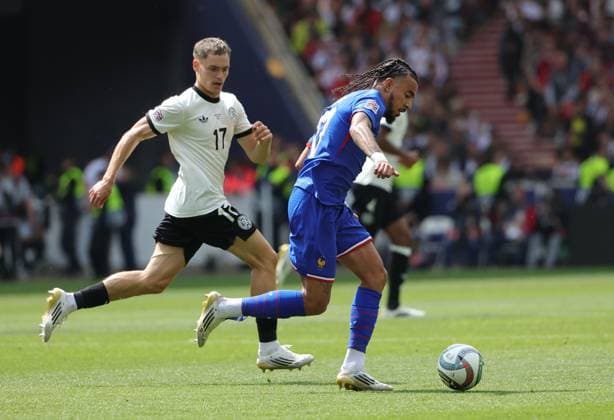 (250609) -- STUTTGART, June 9, 2025 -- Florian Wirtz (L) of Germany vies with Malo Gusto of France during the UEFA Nations League A third-place match between Germany and France in Stuttgart, Germany, June 8, 2025. (Photo by Xinhua) (SP)GERMANY-STUTTGART-FOOTBALL-UEFA NATIONS LEAGUE-GERMANY VS FRANCE PhilippexRuiz 