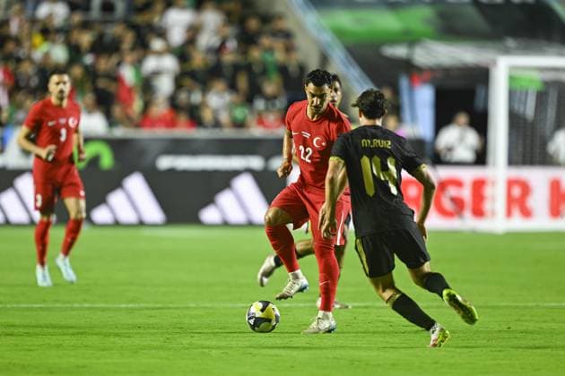 Turkiye v Mexico - Friendlies NORTH CAROLINA, UNITED STATES - JUNE 10: Kaan Ayhan (22) of Turkiye in action against Marcel Ruiz (14) of Mexico during the friendly match between Turkiye and Mexico at Kenan Memorial Stadium at Chapel Hill, North Carolina, United States on June 10, 2025. Celal Gunes Anadolu North Carolina United States. Editorial use only. Please get in touch for any other usage.  Copyright: x2025xAnadoluxCelalxGunesx