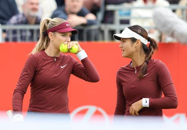 11th June 2025; HSBC Championships, Queen s Club, West Kensington, London, England: HSBC Womens Championships queens Club, Day 3, Katie Boulter (GBR) and Emma Raducanu (GBR) discuss tactics during their loss in the doubles match against number 1 seeds Lyudmyla Kichenok and Erin Routliffe  ActionPlus12800261 HongboxChen