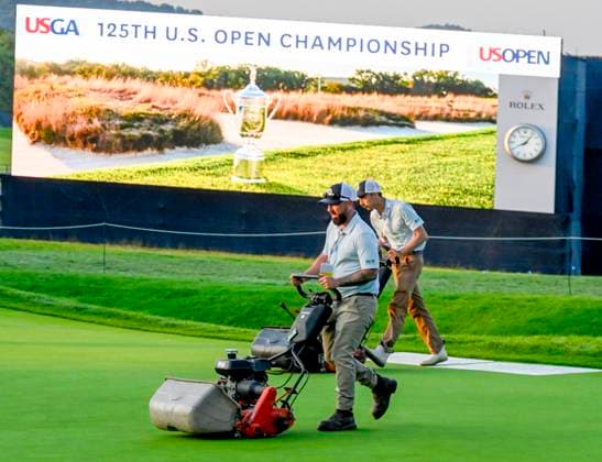 Crews at the 125th U.S. Open Golf Championship at Oakmont Country Club in Oakmont, Pennsylvania prepare for the first day of tournament play as the sun sets on Wednesday, June 11, 2025. The tournament will take place from June 12 to June 15, 2025.  PIT2025061211227 ARCHIExCARPENTER