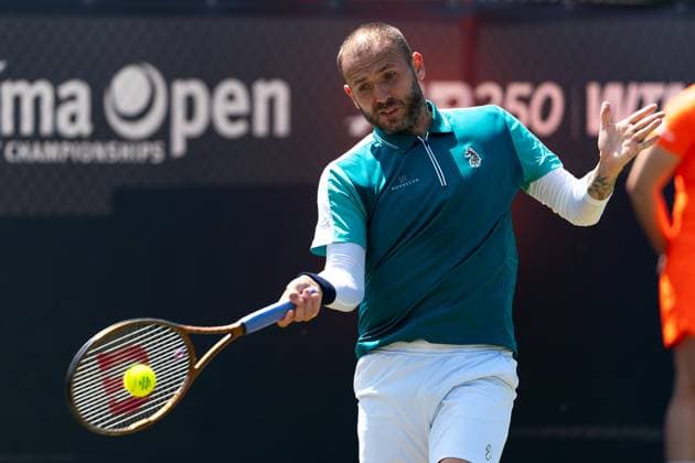 2025-06-12 2025 Libema Open Grass Court Championships ROSMALEN, NETHERLANDS - JUNE 12: Daniel Evans of Great Britain in action during Day Four of 2025 Libema Open Grass Court Championships at Autotron on June 12, 2025 in Rosmalen, Netherlands. Rosmalen Autotron Netherlands Content not available for redistribution in The Netherlands directly or indirectly through any third parties. Copyright: xJorisxVerwijstx