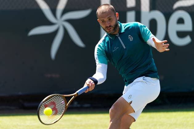 2025-06-12 2025 Libema Open Grass Court Championships ROSMALEN, NETHERLANDS - JUNE 12: Daniel Evans of Great Britain in action during Day Four of 2025 Libema Open Grass Court Championships at Autotron on June 12, 2025 in Rosmalen, Netherlands. Rosmalen Autotron Netherlands Content not available for redistribution in The Netherlands directly or indirectly through any third parties. Copyright: xJorisxVerwijstx