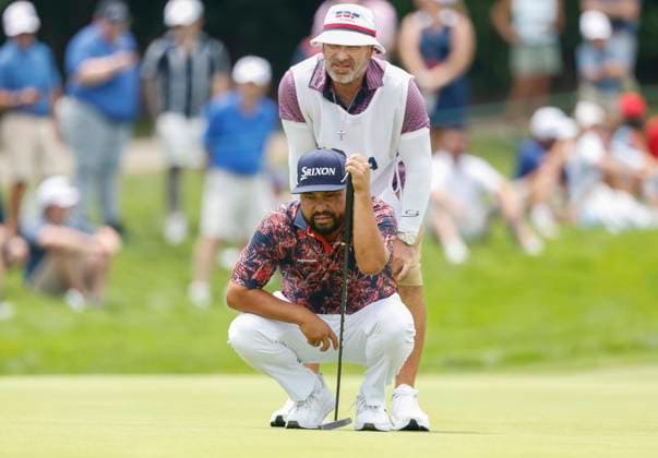 J.J. Spaun and his caddie Mark Carens line up a putt on the 1st hole during the second round of the 125th U.S. Open Golf Championship at Oakmont Country Club in Oakmont, Pennsylvania on Friday, June 13, 2025.  PIT20250613612 JOHNxANGELILLO