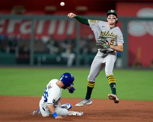 June 13, 2025, Kansas City, Missouri, USA: Athletics shortstop JACOB WILSON (5) turns a double play over Kansas City Royals outfielder JOHN RAVE (26) at Kauffman Stadium Kansas City. Kansas City USA - ZUMAc04_ 20250613_zma_c04_033 Copyright: xJonxRobichaudx