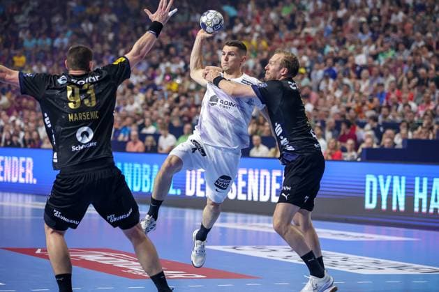 14.06.2025, Handball, Halbfinale TruckScout24 EHF FINAL4, LANXESS arena Köln, Füchse Berlin - HBC Nantes: Aymeric Minne (HBC Nantes FRA 04) gegen Max Darj (Fuechse Berlin 05) Nordrhein-Westfalen Deutschland