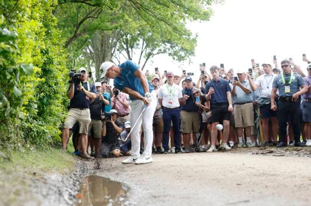 Viktor Hovland of Norway hits off a path after driving his ball into the bushes on the 1st hole during the third round of the 125th U.S. Open Golf Championship at Oakmont Country Club in Oakmont, Pennsylvania on Saturiday, June 14, 2025.  PIT20250614616 JOHNxANGELILLO