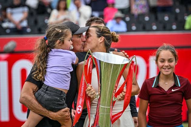 15th June 2025; HSBC Championships, Queens Club, West Kensington, London, England: HSBC Womens Championships Queens Club, Day 7; Tatjana Maria (GER) celebrates with her family with a kiss after winning 15th June 2025; HSBC Championships, Queens Club, West Kensington, London, England: HSBC Womens Championships Queens Club, Day 7; Tatjana Maria (GER) celebrates by lifting the new women s trophy after winning the womens singles final against Amanda Anisimova (USA) ActionPlus12801499 GodfreyxPitt