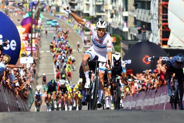 Belgian Jasper Philipsen of Alpecin-Deceuninck celebrates as he crosses the finish line to win the first stage of the Baloise Belgium Tour cycling race, 198km from Merelbeke-Melle to Knokke-Heist, Wednesday 18 June 2025. The Baloise Belgium Tour takes place from 18 to 22 June. DAVIDxPINTENS  x127335047x