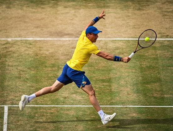 21st June 2025; HSBC Championships, Queens Club, West Kensington, London, England: HSBC Mens Championships Queens Club, Day 6; Roberto Bautista Agut (ESP) hits a volley in his semi final match against Carlos Alcaraz (ESP)  ActionPlus12803812 GodfreyxPitt
