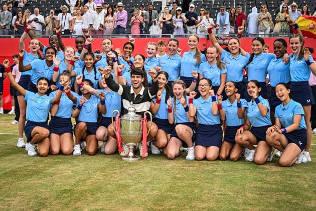 22nd June 2025; HSBC Championships, Queens Club, West Kensington, London, England: HSBC Mens Championships Queens Club, Day 7; Carlos Alcaraz (ESP) celebrates winning the final against Jiri Lehecka (CZE) and poses with the trophy with the ballgirls  ActionPlus12804263 GodfreyxPitt