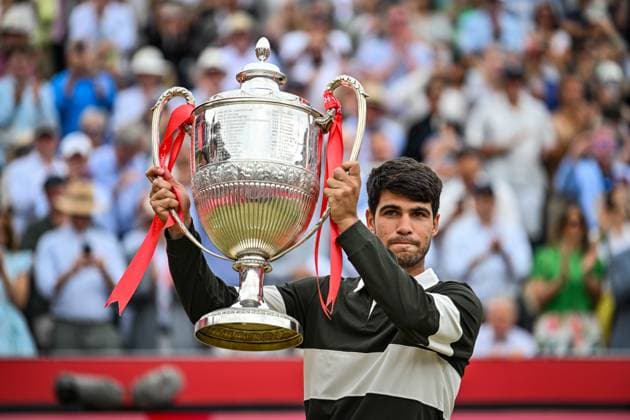 22nd June 2025; HSBC Championships, Queens Club, West Kensington, London, England: HSBC Mens Championships Queens Club, Day 7; Carlos Alcaraz (ESP) celebrates winning the final against Jiri Lehecka (CZE) and poses with the Queen s Cup Gentlemen s Open Singles trophy  ActionPlus12804256 GodfreyxPitt