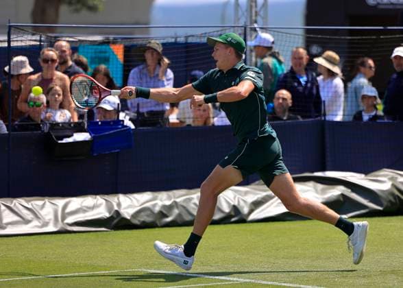 22nd June 2025; Devonshire Park, Eastbourne, East Sussex, England: Lexus International Eastbourne, Qualifying Day 2; Jenson Brooksby (USA) plays a forehand against Aleksandar Vukic (AUS)  ActionPlus12804301 HongboxChen