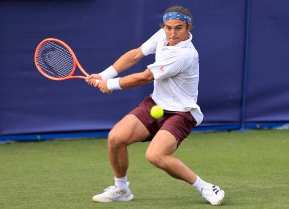22nd June 2025; Devonshire Park, Eastbourne, East Sussex, England: Lexus International Eastbourne, Qualifying Day 2; Mattia Bellucci (ITA) plays a backhand shot against Chun-Hsin Tseng (TPE)  ActionPlus12804338 HongboxChen