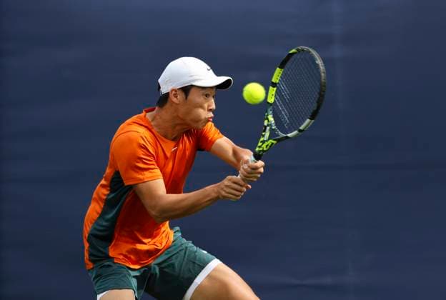 22nd June 2025; Devonshire Park, Eastbourne, East Sussex, England: Lexus International Eastbourne, Qualifying Day 2; Chun-Hsin Tseng (TPE) plays a backhand shot against Mattia Bellucci (ITA)  ActionPlus12804464 HongboxChen