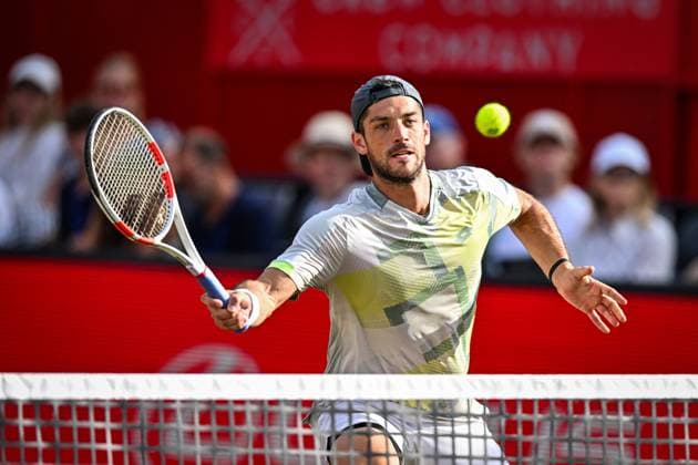 22nd June 2025; HSBC Championships, Queens Club, West Kensington, London, England: HSBC Mens Championships Queens Club, Day 7; Julian Cash (GBR) hits a volley in the mens doubles final match with partner Lloyd Glasspool (GBR) against Nikola Mektic (CRO) and Michael Venus (NZL)  ActionPlus12804575 GodfreyxPitt