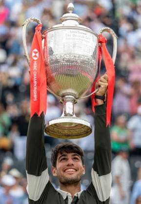 (250623) -- LONDON, June 23, 2025 -- Carlos Alcaraz celebrates with the trophy during the awarding ceremony for the men s singles final between Carlos Alcaraz of Spain and Jiri Lehecka of the Czech Republic at the Queen s Club Championships in London, Britain, on June 22, 2025. (Photo by Xinhua) (SP)BRITAIN-LONDON-TENNIS-QUEEN S CLUB CHAMPIONSHIPS-MEN S SINGLES-FINAL StephenxChung 
