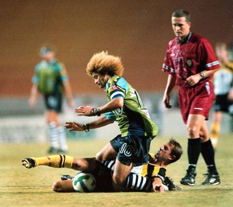 Florida News - January 31, 1997 TP OT10018 - - DELIVER TO: SPORTS - - 9 27 96 - - tampa - - STORY SUMMARY: - - CAPTION INFO: This is game 2 in the best of 3 series in the first round of the playoff between the Columbus Crew and the Tampa Bay Mutiny. In a physical first half, Carlos Valderrama gets knocked down by Columbus Crew mid fielder Robert Warzycha as the referee watches in the background. this was at Houlihan s stadium.- - Times Photo by: Victor Junco - - Story By: - - SCANNED BY: victor junco - - RUN DATE: Copyright: xStxPetersburgxTimesx