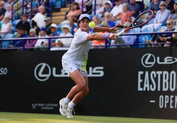 25th June 2025; Devonshire Park, Eastbourne, East Sussex, England; Lexus International Eastbourne, Day 3; Joao Fonseca (BRA) plays a backhand shot against Taylor Fritz (USA)  ActionPlus12805567 HongboxChen