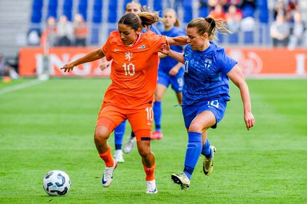 Danielle van de Donk of the Netherlands dribbles with the ball under pressure from Oona Siren of Finland Netherlands v Finland, , Netherlands v Finland, Kooi Stadion, June 26, 2025, Leeuwarden, Netherlands.