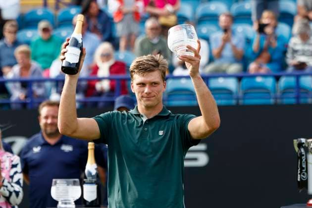 28th June 2025; Devonshire Park, Eastbourne, East Sussex, England; Lexus International Eastbourne, Day 6; Jensen Brooksby (USA) lifts the finalists trophy in the mens singles final match  ActionPlus12806404 HongboxChen