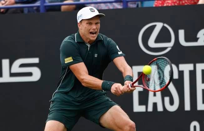 28th June 2025; Devonshire Park, Eastbourne, East Sussex, England; Lexus International Eastbourne, Day 6; Jensen Brooksby (USA) plays a backhand shot against Taylor Fritz (USA) in the mens singles final match  ActionPlus12806425 HongboxChen